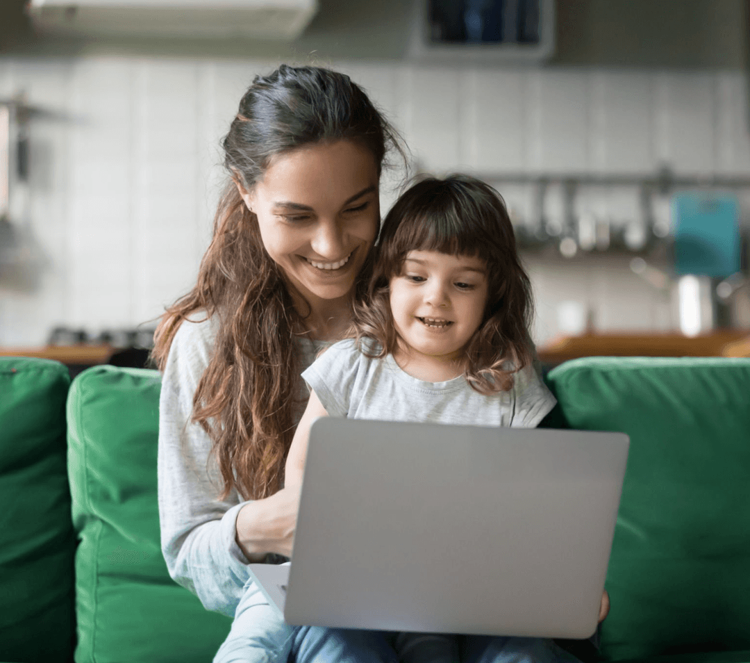Mother and child using laptop